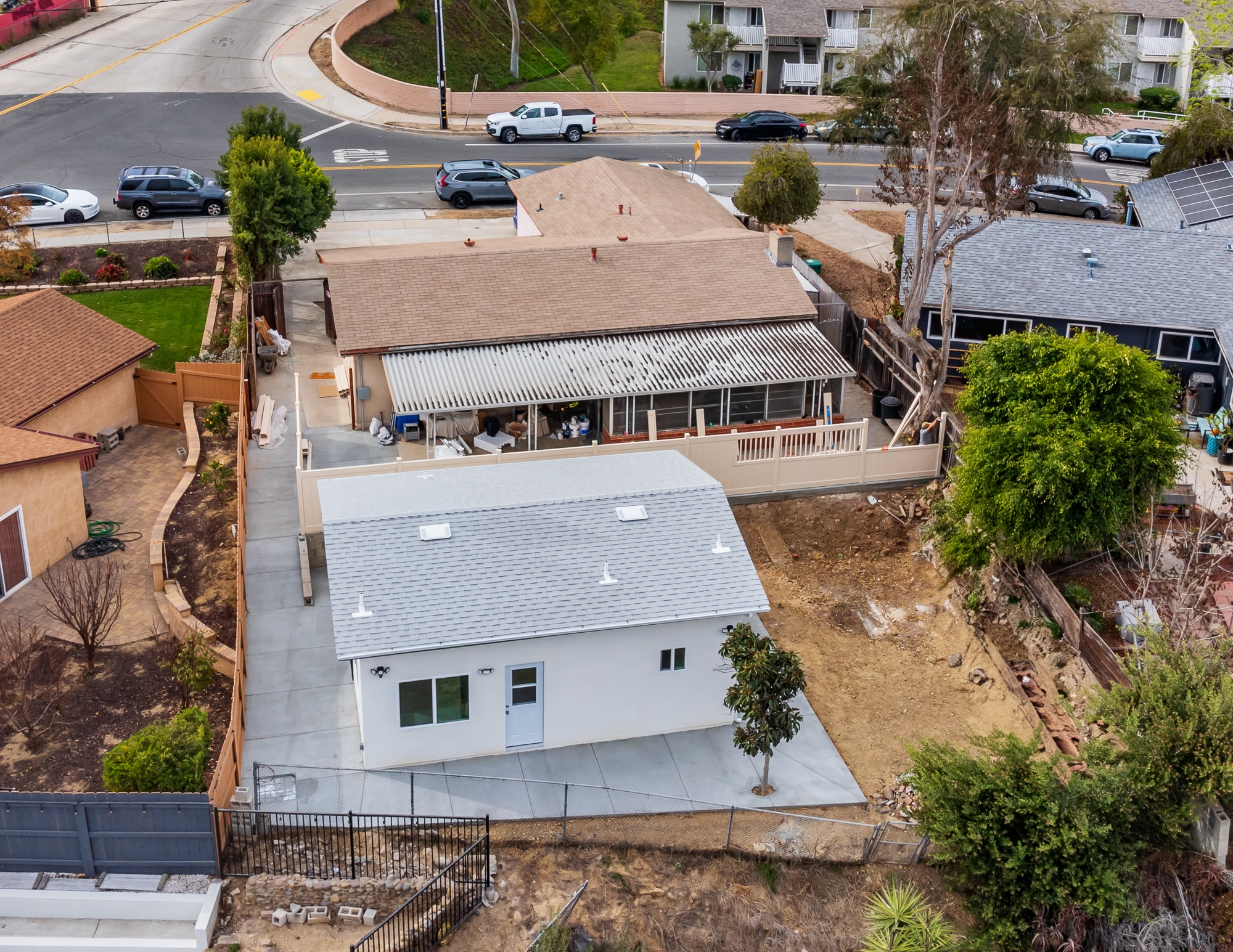 Aerial view of a completed detached ADU in the rear yard of a San Diego property, showing its position relative to the main house and neighbouring lots