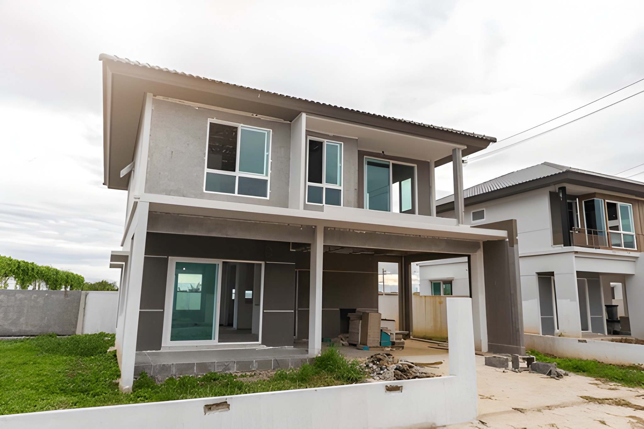 Two-storey home under construction with exterior framing and sheathing in place